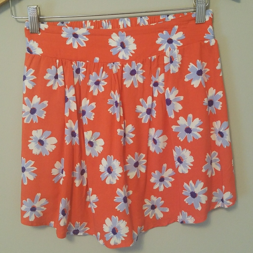 Orange skirt with blue and white floral design